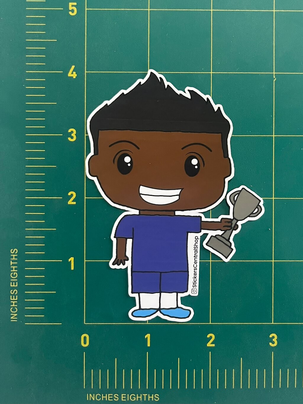 Champion Soccer Player Sticker, blue with trophy