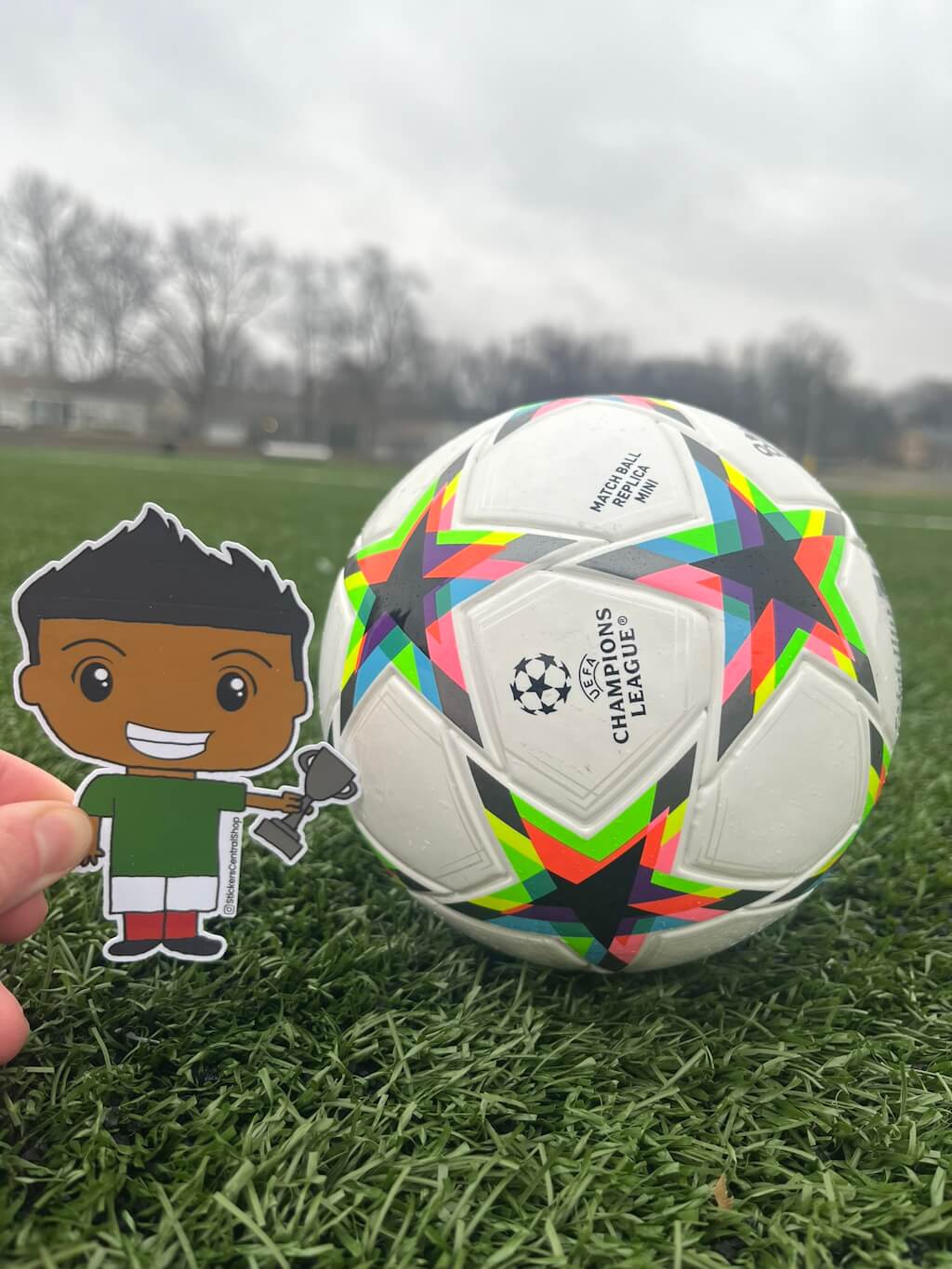 Champion Soccer Player Sticker, green and white with trophy