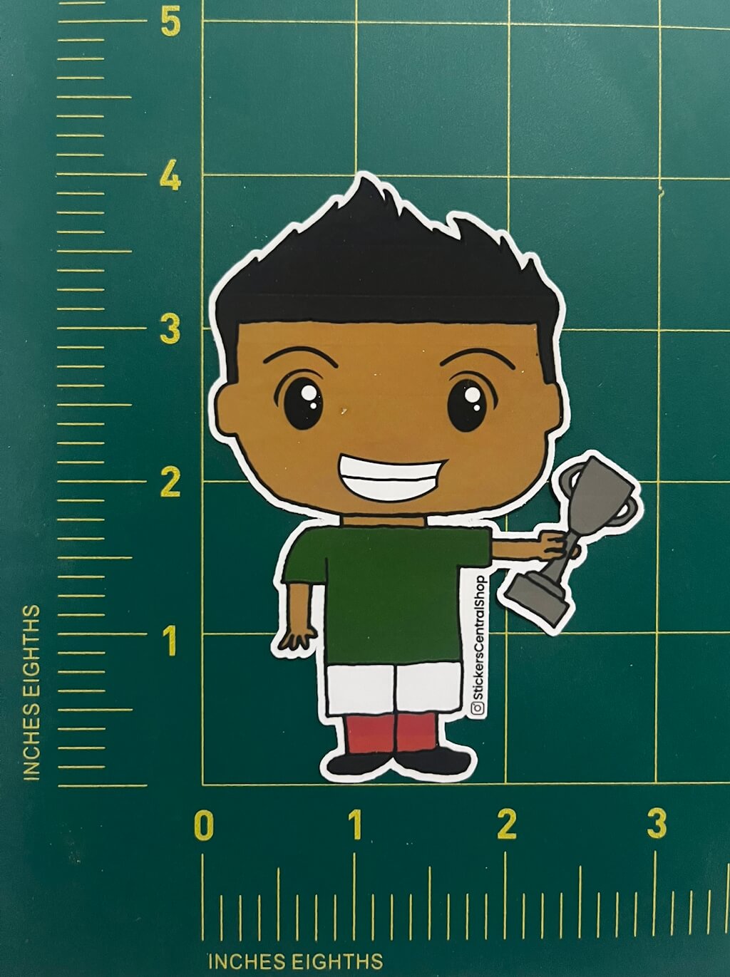 Champion Soccer Player Sticker, green and white with trophy