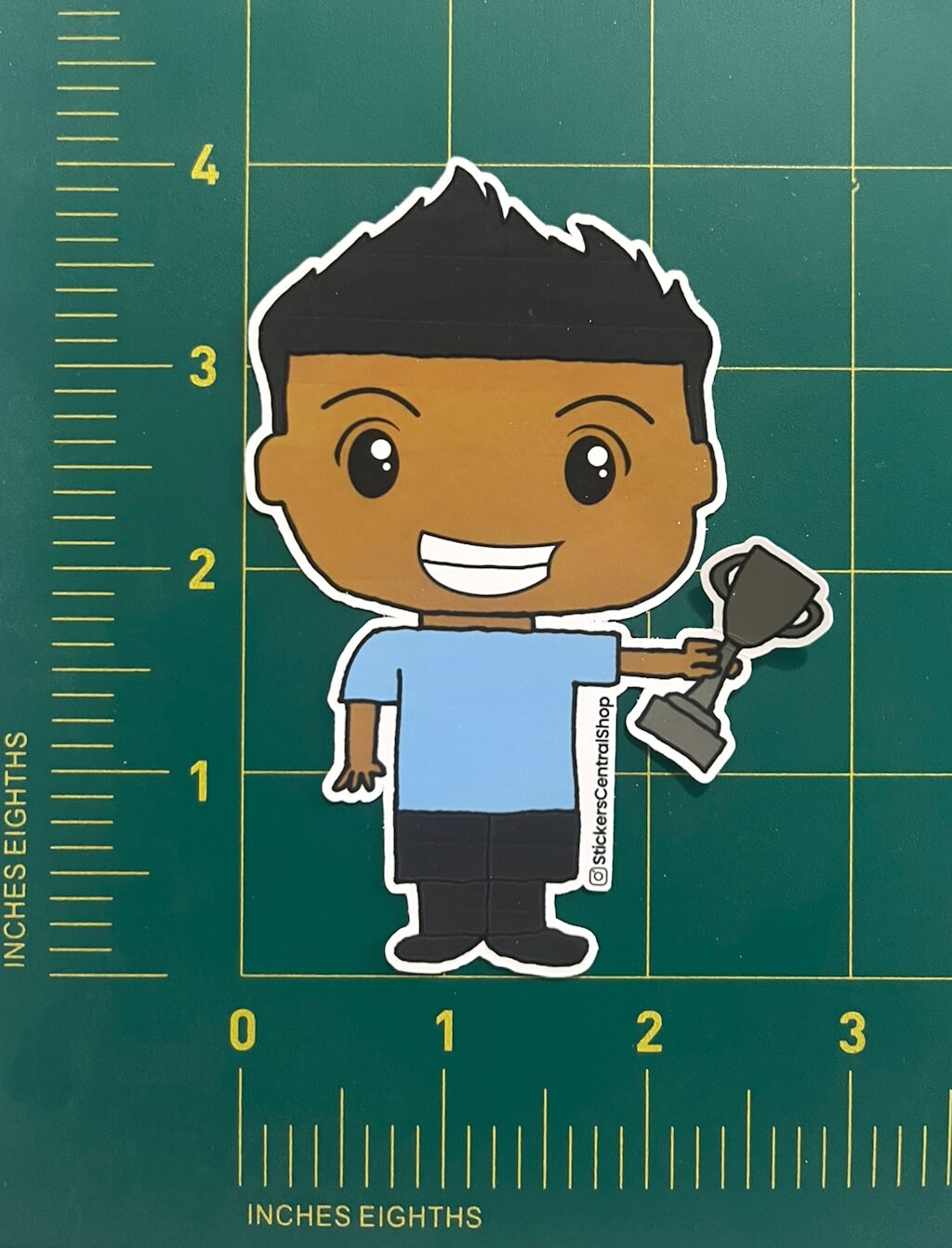 Uruguay Champions Soccer Player Sticker, light blue and black with trophy