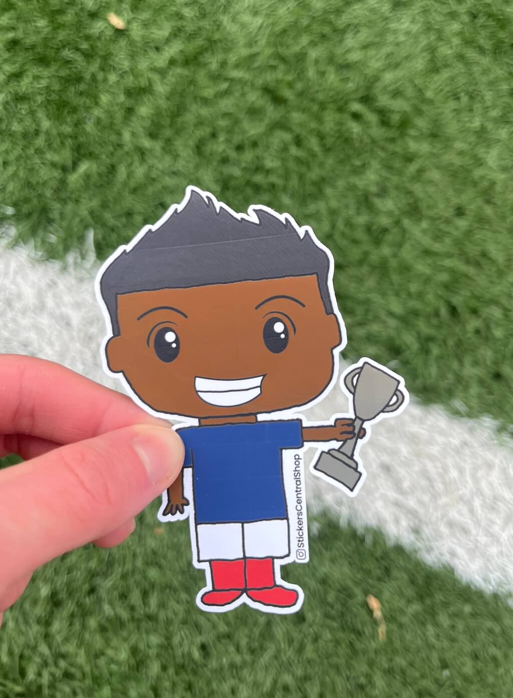 Champion Soccer Player Sticker, blue and white with trophy