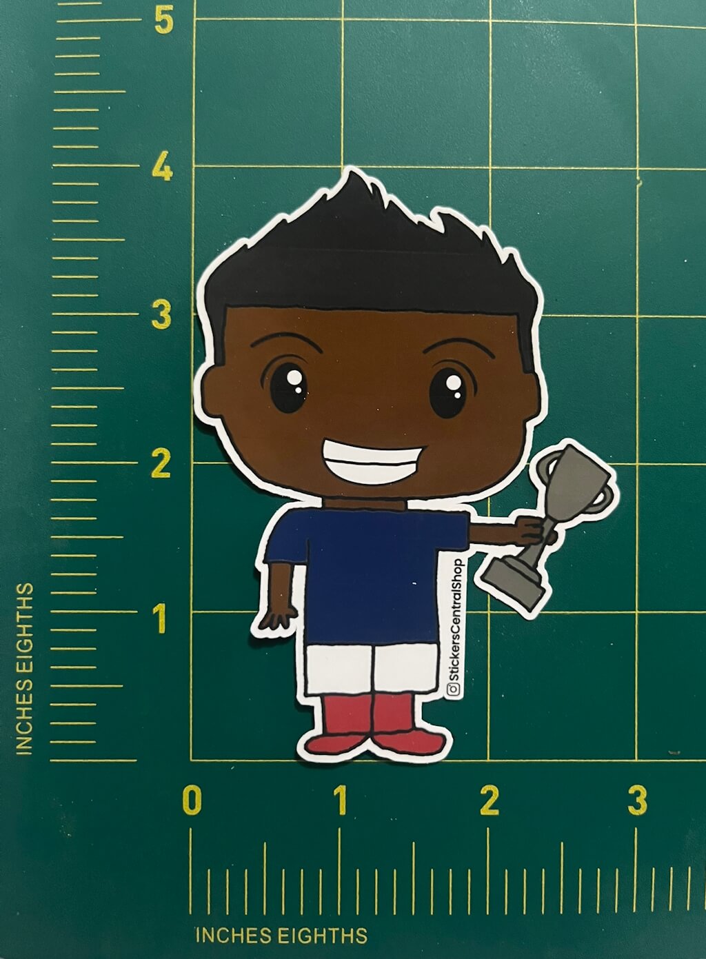 Champion Soccer Player Sticker, blue and white with trophy