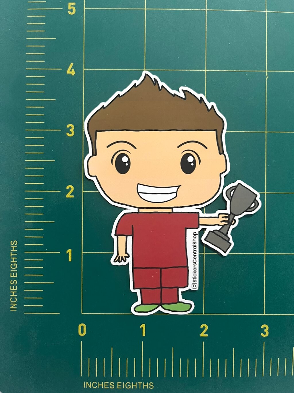 Champion Soccer Player Sticker, red with trophy