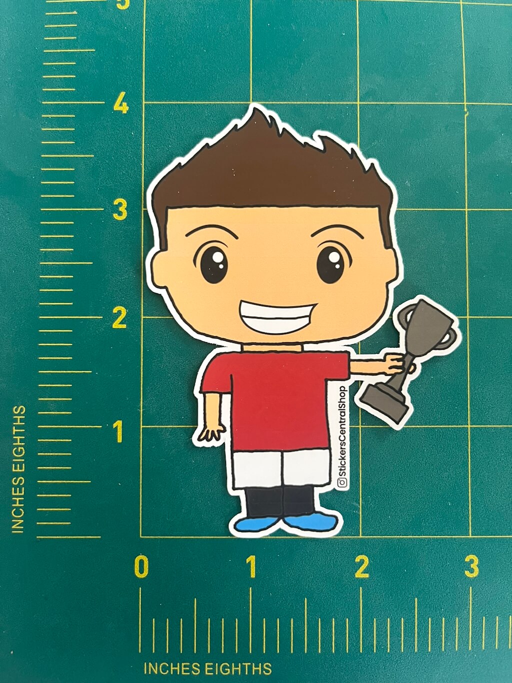 Champion Soccer Player Sticker, red and white with trophy