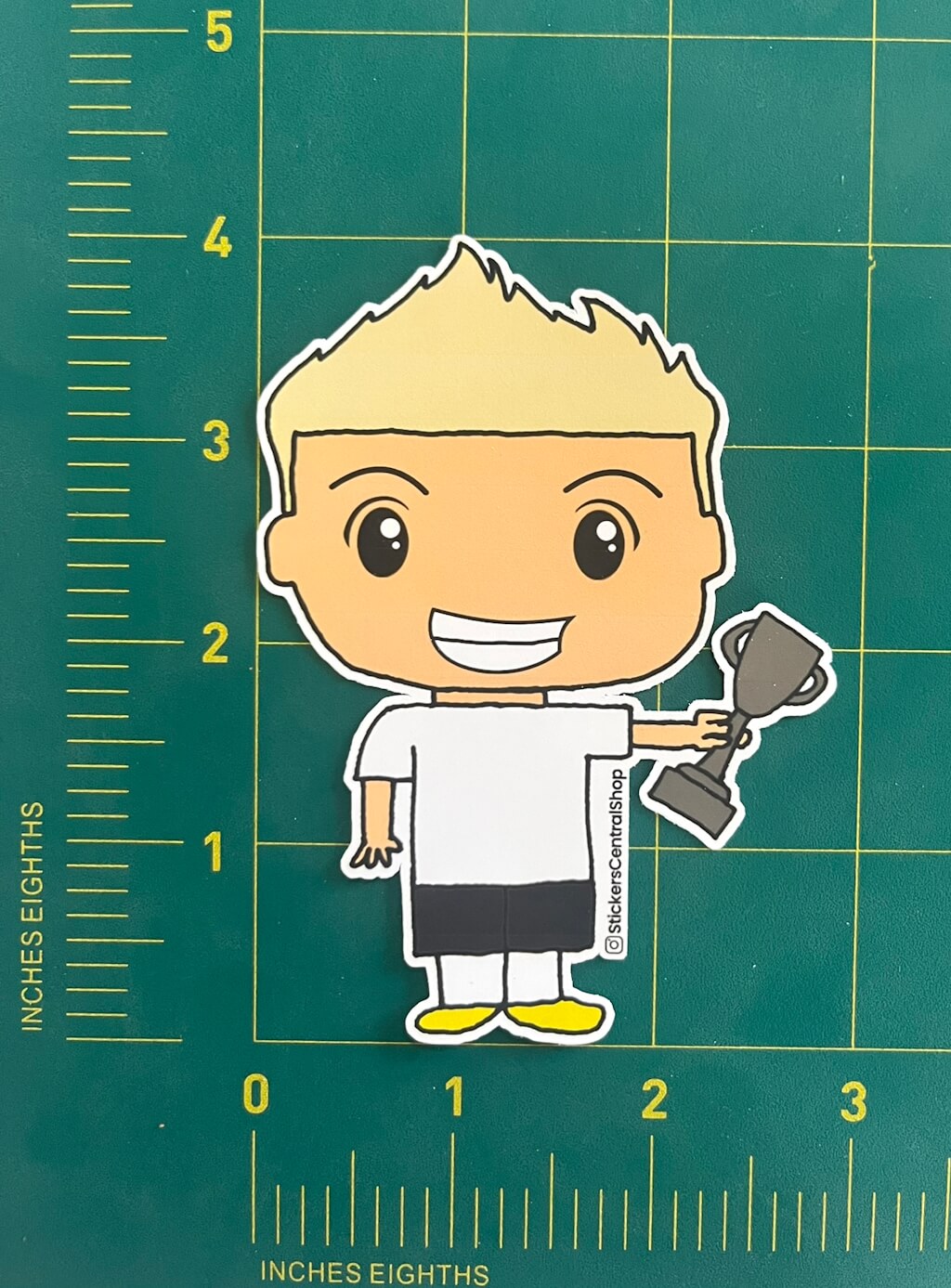 Champion Soccer Player Sticker, white and black with trophy