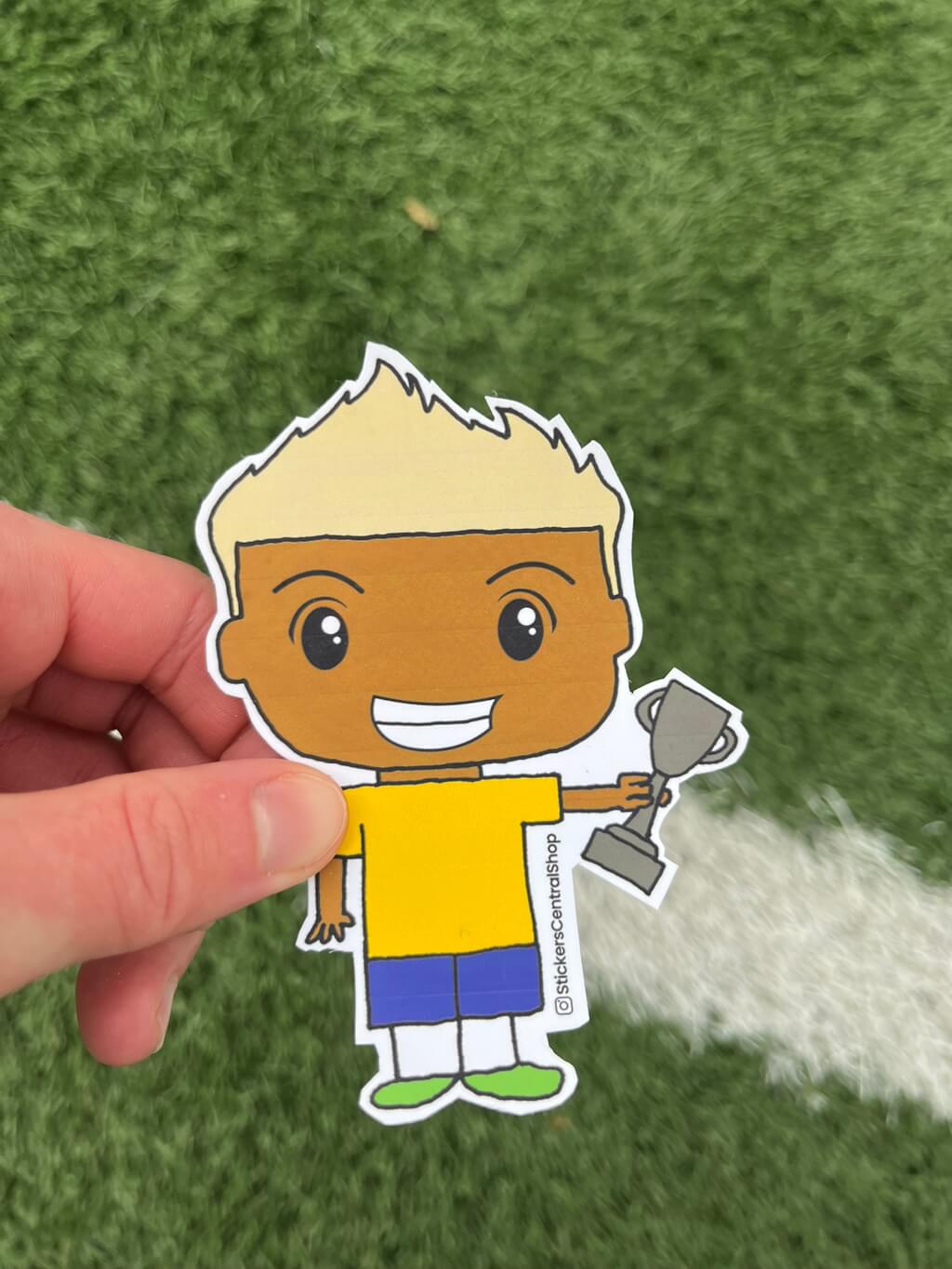 Brazil Champions Soccer Player Sticker, yellow and blue with trophy